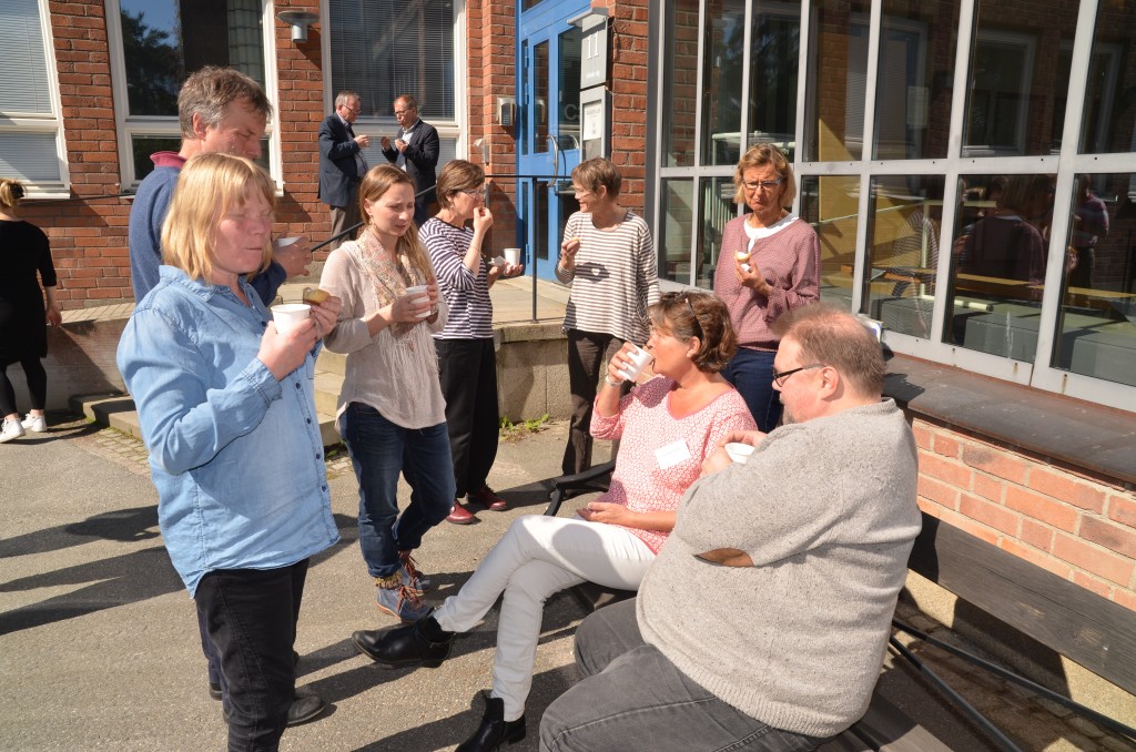 Project partners mingle outdoors between meeting sessions. Photo: Jonas Förare